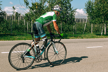 Image showing Dnipro, Ukraine - July 12, 2019: athlete with disabilities or amputee training in cycling