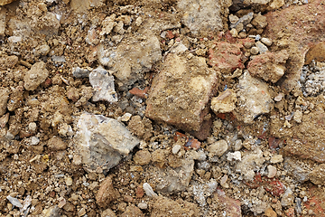 Image showing Rough broken concrete and brick, mixed with soil and stones