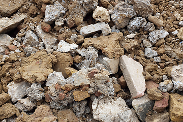 Image showing Rough heap of broken concrete, bricks and paving slabs 