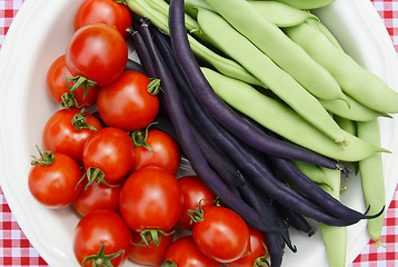 Image showing Cherry tomatoes with purple French beans and green Calypso beans