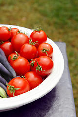 Image showing Ripe red tomatoes in a white serving dish