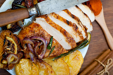 Image showing roasted grilled BBQ chicken breast with herbs and spices 