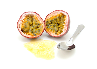 Image showing Passion fruit cut in half with juicy pulp and seeds