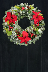 Image showing Poinsettia Flower and Winter Greenery Wreath