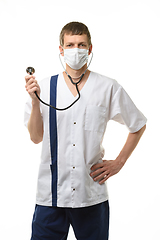 Image showing Doctor in mask with phonendoscope in hands isolated on white background