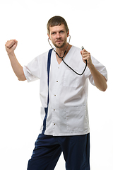 Image showing Cheerful doctor funny dancing with phonendoscope phonendoscope isolated on white background