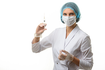 Image showing Portrait of a nurse with a syringe in hand, isolated on white background