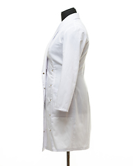 Image showing Medical gown hanging on a mannequin, side view, isolated on white background
