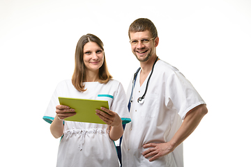 Image showing The doctor and the nurse discuss the patient\'s tests and look happily into the frame