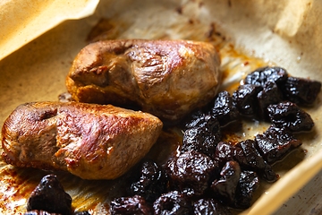 Image showing Roast duck breast with plums prepared closeup