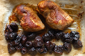 Image showing Roast duck breast with plums prepared closeup