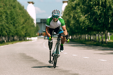 Image showing Athlete disabled amputee training in cycling