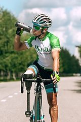 Image showing Dnipro, Ukraine - July 12, 2019: athlete with disabilities or amputee training in cycling