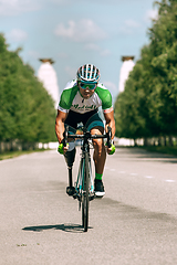 Image showing Dnipro, Ukraine - July 12, 2019: athlete with disabilities or amputee training in cycling