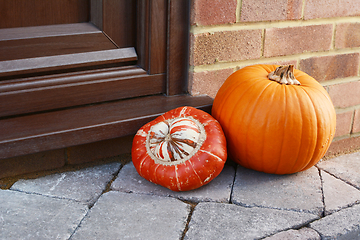 Image showing Turks Turban gourd and an orange pumpkin as autumnal decoration