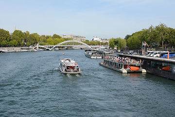 Image showing Tourist river cruise ferry full with passengers at the Port de l