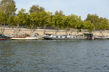 Image showing Small riverboats moored on the Seine in Paris