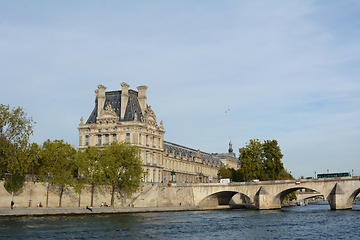 Image showing Louvre Palace building at Pont Royal bridge over the Seine