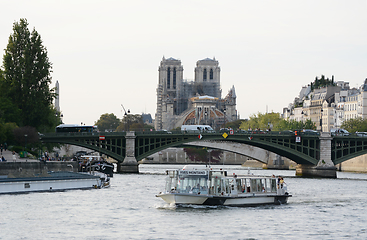 Image showing Pont Sully bridge spans the river Seine beyond river traffic in 