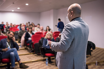 Image showing successful businessman giving presentations at conference room