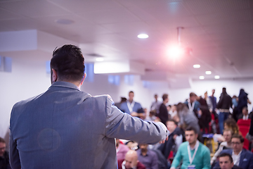 Image showing successful businessman giving presentations at conference room