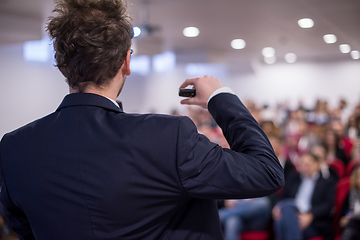 Image showing successful businessman giving presentations at conference room