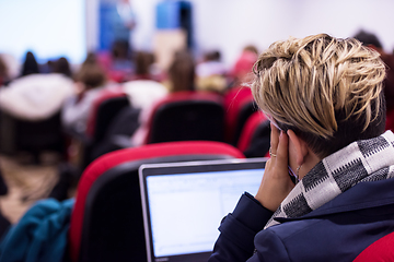 Image showing businesswoman using laptop computer during seminar