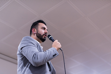 Image showing successful businessman giving presentations at conference room