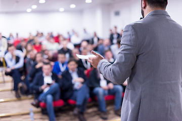 Image showing successful businessman giving presentations at conference room