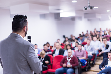 Image showing successful businessman giving presentations at conference room