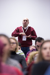 Image showing successful businessman giving presentations at conference room