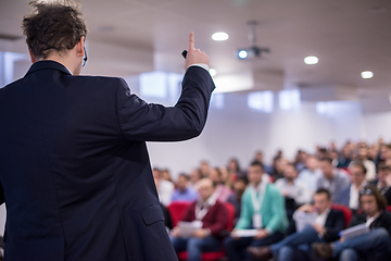 Image showing successful businessman giving presentations at conference room