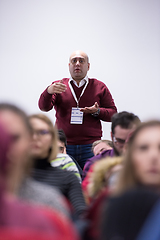 Image showing successful businessman giving presentations at conference room