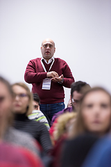 Image showing successful businessman giving presentations at conference room