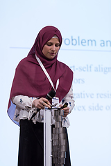 Image showing Muslim businesswoman giving presentations