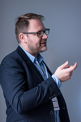 Image showing successful businessman giving presentations at conference room