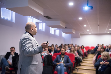 Image showing successful businessman giving presentations at conference room