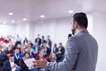 Image showing successful businessman giving presentations at conference room