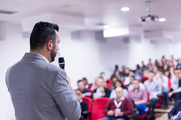 Image showing successful businessman giving presentations at conference room