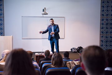 Image showing successful businessman giving presentations at conference room