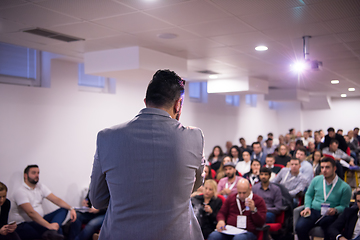 Image showing successful businessman giving presentations at conference room