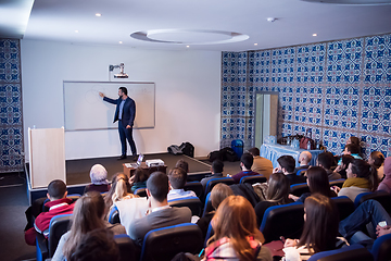 Image showing successful businessman giving presentations at conference room