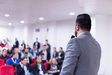 Image showing successful businessman giving presentations at conference room