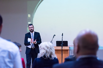 Image showing successful businessman giving presentations at conference room