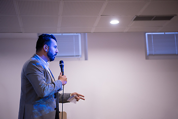 Image showing successful businessman giving presentations at conference room