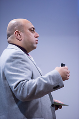 Image showing successful businessman giving presentations at conference room