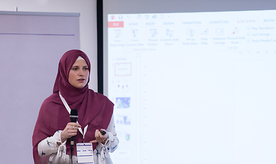 Image showing Muslim businesswoman giving presentations