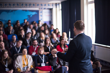 Image showing successful businessman giving presentations at conference room