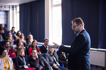 Image showing successful businessman giving presentations at conference room