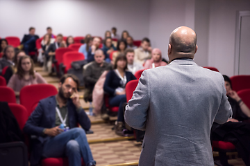 Image showing successful businessman giving presentations at conference room